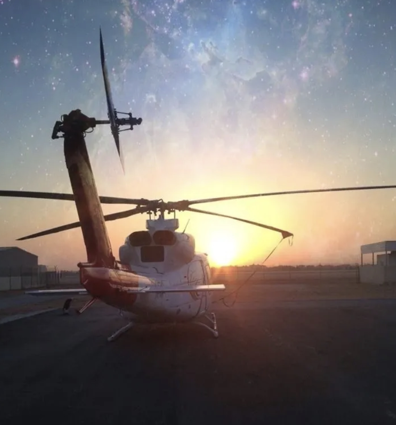 Bell 412 helicopter at sunrise