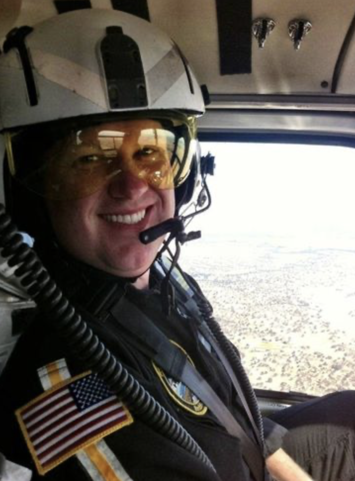 A. Kleinschmidt in flight gear inside helicopter
